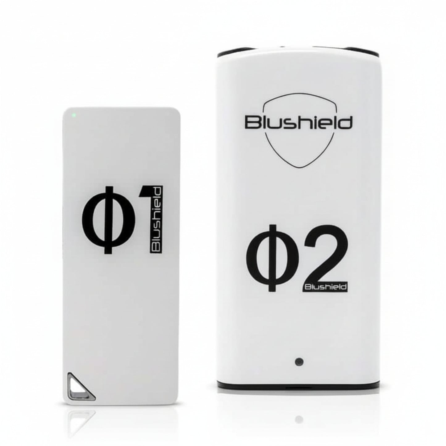 two white devices look like cell phones  for EMF protection, one says Φ1 Blushield, the other says Blushield Φ2