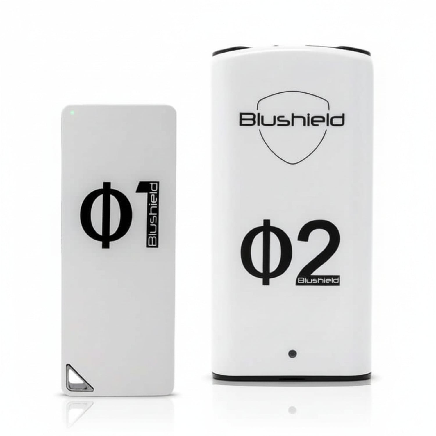 two white devices look like cell phones  for EMF protection, one says Φ1 Blushield, the other says Blushield Φ2