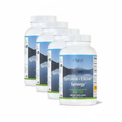 Four bottles of Spirulina + E3Live Synergy dietary supplement on a white background