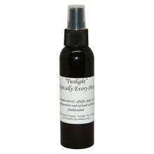 Black spray bottle of Topically Every Pain with a white label on a white background