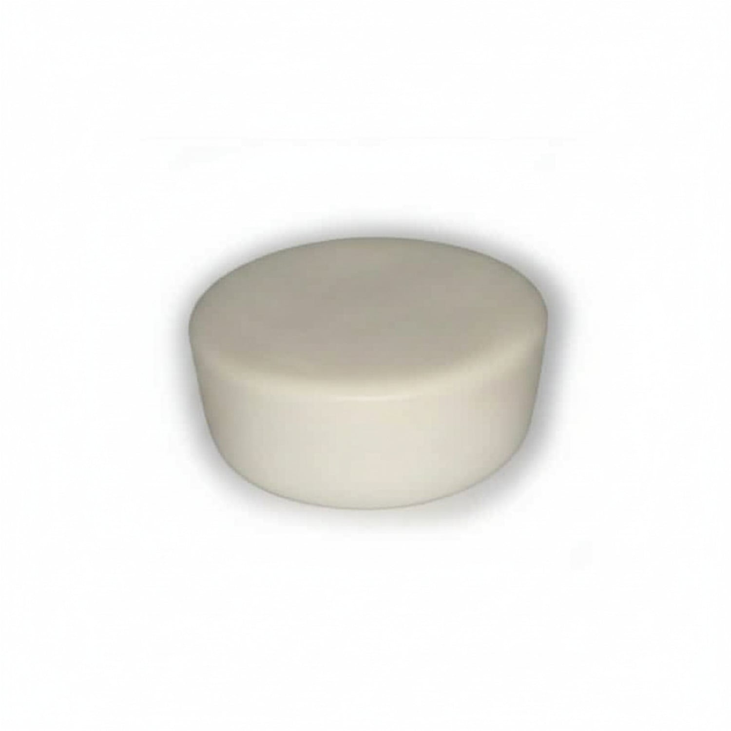 Round ivory cupcake-shaped device on a white background