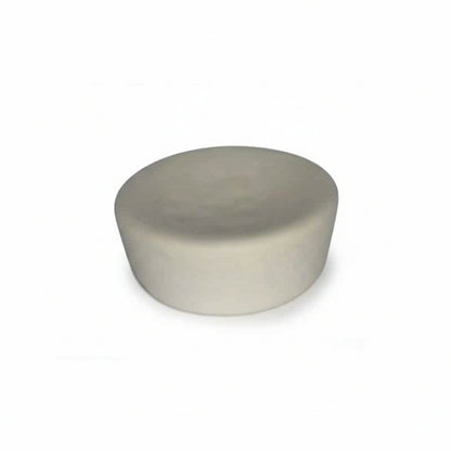 Round ivory cupcake-shaped device on a white background