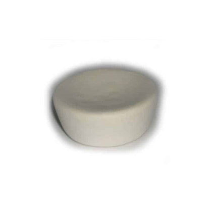 Round ivory cupcake-shaped device on a white background