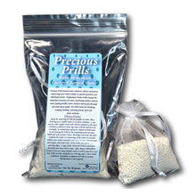 Package of 'Precious Prills' with a clear bag containing white beads on a white background
